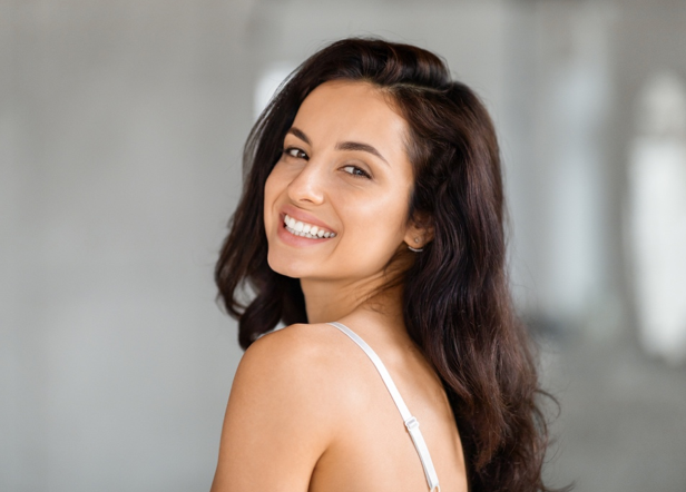 Image of a woman who just received a Vampire Facial from Arc Med Aesthetics in Solana Beach.